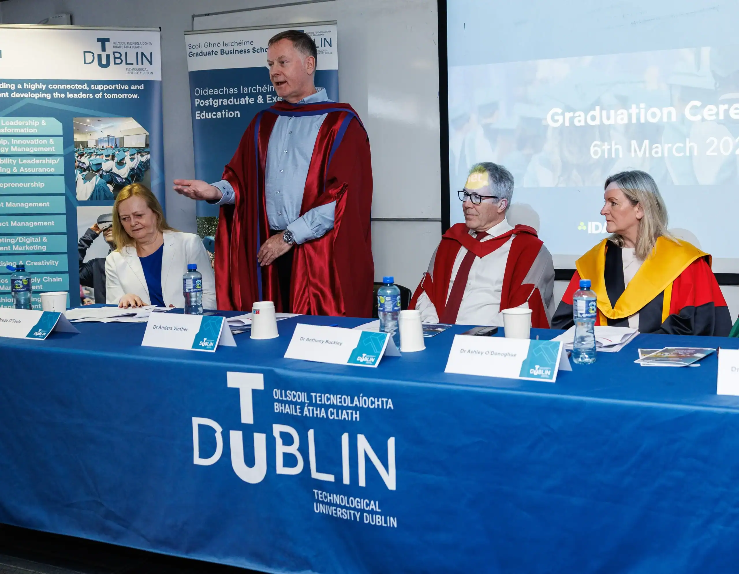 Graduation ceremony with speakers and audience