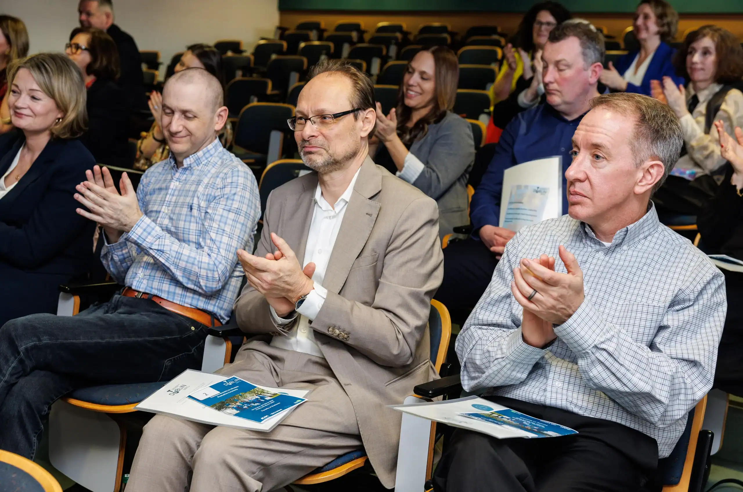 Audience clapping at an event